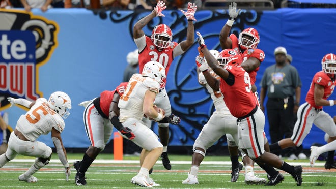 Georgia looks to take down Texas quarterback Sam Ehlinger during last year’s Sugar Bowl in New Orleans. The Bulldogs lost, but get a chance at a redo this year as they face Baylor tonight. (File photo/Dean Legge, Dawg Post)