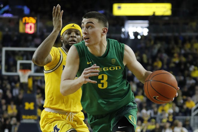 Payton Pritchard has led Oregon to an 11-2 nonconference record, including a 71-70 overtime win over Zavier Simpson and Michigan on Dec. 14 in Ann Arbor, Mich. [Rick Osentoski/USA Today Sports]