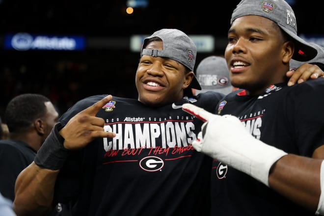 Georgia outside linebacker Nolan Smith and defensive lineman Travon Walker celebrate after Georgia’s Sugar Bowl win over Baylor at the Superdome in New Orleans, La., on Wednesday, Jan. 1, 2020. (Photo by Tony Walsh)