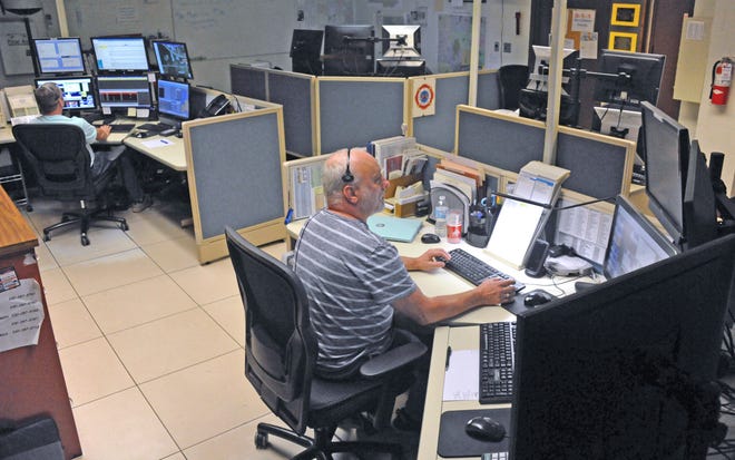 Josh Glessner and Mark Bartholomew serve as dispatchers for the Wayne County Emergency Dispatch Services. The county plans to move them and the entire dispatch area to an upper level next to the Wayne County Sheriff's Office in the Wayne County Justice Center in Wooster.
