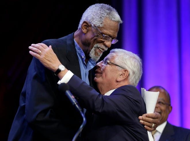 FILE - In this Wednesday, Oct. 2, 2013 file photo, Former Boston Celtics basketball player Bill Russell, left, hugs National Basketball Association Commissioner David Stern during an award ceremony for the W.E.B. Du Bois Medal at Harvard University, in Cambridge, Mass. David Stern, who spent 30 years as the NBA's longest-serving commissioner and oversaw its growth into a global power, has died on New Yearâ€™s Day, Wednesday, Jan. 1, 2020. He was 77. (AP Photo/Steven Senne, FGile)