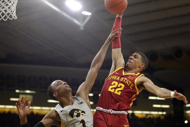 Iowa State guard Tyrese Haliburton (22) is fouled by Iowa guard Maishe Dailey (1) while driving to the basket during the first half of a game last season in Iowa City, Iowa. [AP Photo/Charlie Neibergall]