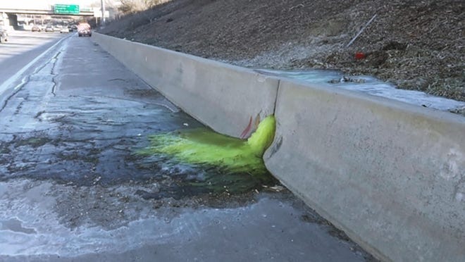 This photo provided by Michigan Department of Transportation toxic chemical substances leaked along Interstate 696 in Madison Heights, Mich., on Dec. 20, 2019. The discovery led to an investigation of an old industrial site near the interstate. State regulators said high levels of multiple contaminants have been found in soil and groundwater around the former Electro-Plating Services. (Michigan Department of Transportation via AP)