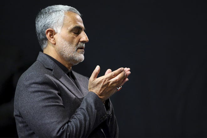 In this March 27, 2015, file photograph provided by an official website of the office of the Iranian supreme leader, commander of Iran's Quds Force, Qassem Soleimani prays in a religious ceremony at a mosque in the residence of Supreme Leader Ayatollah Ali Khamenei, in Tehran, Iran. Iraqi TV and three Iraqi officials said Friday, Jan. 3, 2020, that Soleimani has been killed in an airstrike at Baghdad's international airport. [Office of the Iranian Supreme Leader via AP, File]
