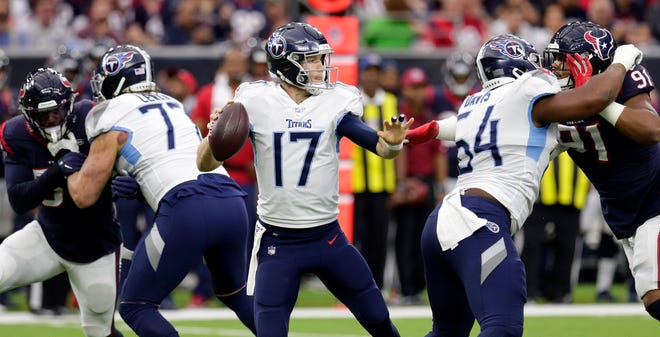Tennessee Titans quarterback Ryan Tannehill (17) looks to throw a pass against the Houston Texans during the first half of an NFL football game Sunday, Dec. 29, 2019, in Houston. (AP Photo/Michael Wyke)