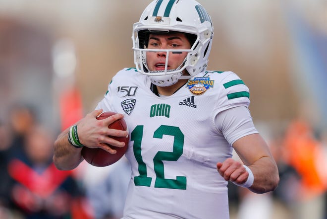Ohio quarterback Nathan Rourke (12) arrives in the end zone on a 35-yard touchdown run against Nevada in the first half of the Famous Idaho Potato Bowl NCAA college football game Friday, Jan. 3, 2020, in Boise, Idaho. (AP Photo/Steve Conner)