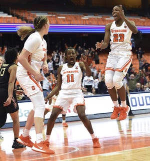 Syracuse celebrates their upset win over Florida State on Thursday at the Carrier Dome in Syracuse, N.Y. [Dennis Nett/dnett@syracuse.com]