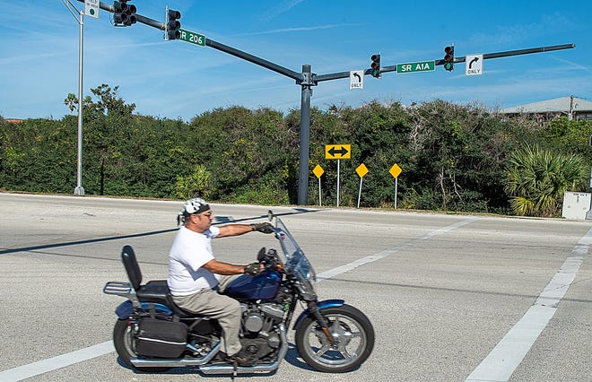A motorcyclist turns right on to State Road A1A from State Road 206 on Friday. On Dec. 25 a 63-year-old man on a motorcycle was killed in a crash with a car at the intersection. On Dec. 23 a 31-year-old man on a motorcycle was killed in a crash on State Road 206 just west of the intersection. [PETER WILLOTT/THE RECORD]