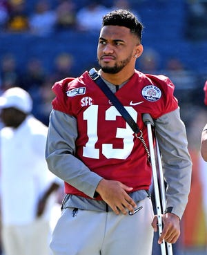 Alabama Crimson Tide quarterback Tua Tagovailoa looks on from the field prior to the game against the Michigan Wolverines on Wednesday, Jan. 1, 2020 at Camping World Stadium. [Jasen Vinlove-USA TODAY Sports]