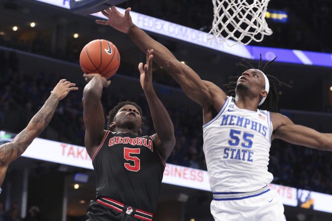 Memphis forward Precious Achiuwa (55) defends as Georgia guard Anthony Edwards (5) shoots in the first half of the Bulldogs’ 65-62 vicotry over the ninth-ranked Tigers. (AP Photo/Karen Pulfer Focht)