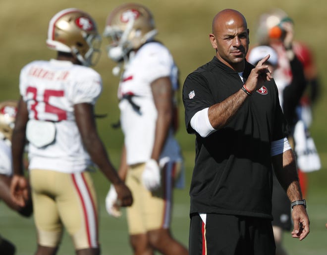 San Francisco 49ers defensive coordinator Robert Saleh directs players during a combined NFL training camp with the Denver Broncos Saturday, Aug. 17, 2019, at the Broncos' headquarters in Englewood, Colo. The Cleveland Browns interviewed Saleh on Saturday for their vacant head coaching job. (AP Photo/David Zalubowski)