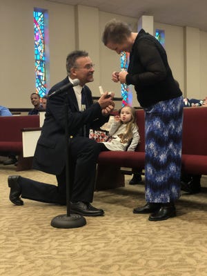 Bill Ward proposes to his wife, Donna, at South Gastonia Church of God Sunday, Dec. 29, 2019. [Gavin Stewart/The Gaston Gazette]
