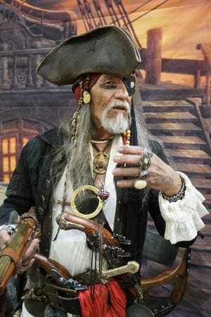 Roger Ashton, of Woonsocket, portrays pirate Jaak Hawksby at the Rhode Island Boat Show. [The Providence Journal / Sandor Bodo]