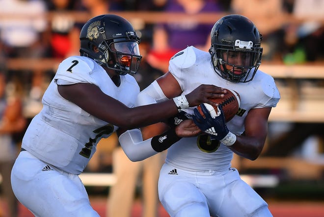 Topeka High quarterback Da'Vonshai Harden (2) and running back Ky Thomas were a devastating duo in the Trojan backfield for the past three seasons. Both have been selected to play in the 2020 Kansas Shrine Bowl, which will be held July 18 in Topeka. [File photo]