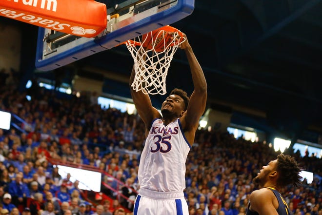 Kansas senior Udoka Azubuike dunks against West Virginia in the first half of their game Saturday inside Allen Fieldhouse. Azubuike scored a total of 17 points in the Jayhawks 60-53 victory over West Virginia. [Evert Nelson/The Capital-Journal]