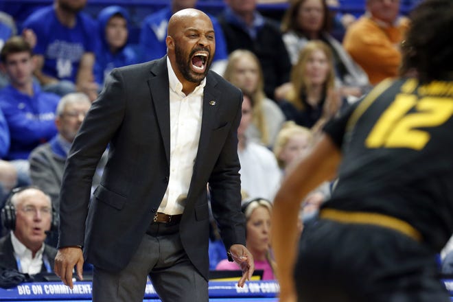 Missouri head coach Cuonzo Martin yells to his team during the Tigers' loss to the Wildcats in Lexington, Ky., Saturday. [James Crisp/The Associated Press]