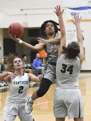 Flagler Palm Coast's Brianna Ellis (1) drives for a layup during Saturday’s game against the Allen Nease Panthers, Ellis led the team in scoring and helped engineer the heroics in the final minutes leading up to a 48-45 victory. [News-Tribune/ Bob Rollins]