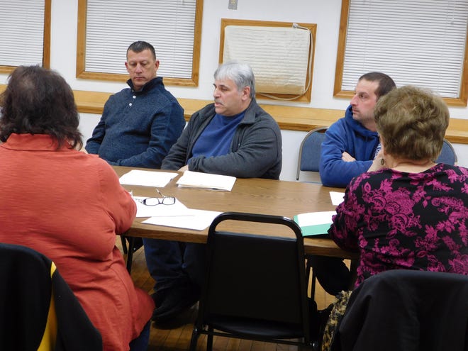 Facing forward are, from left, Public Works Foreman Mike Irons, Power and Light Foreman Joe Salvaggio and Fire Chief Eric Conigliaro during Thursday’s meeting of the Frankfort Village Board of Trustees. [DONNA THOMPSON/TIMES TELEGRAM]