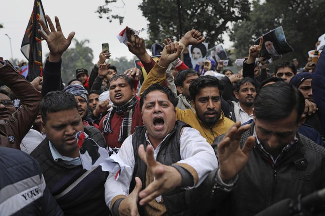Indian Shiite Muslims shout slogans during a protest against the recent U.S. attack that killed Iranian Gen. Qassem Soleimani, near U.S. embassy in New Delhi, India, Tuesday, Jan. 7, 2020. (AP Photo/Altaf Qadri)
