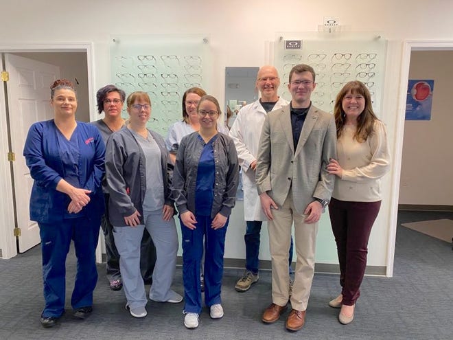 Dr. Alison S. Ridenour, right, and Dr. Jerzy S. Kornilow are pictured with their son Jacob Kornilow and the support staff of Antietam Eye Associates celebrating a decade of serving the Waynesboro area. PROVIDED PHOTO.