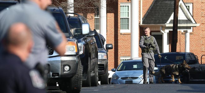 Belmont police use K-9 at the scene of a robbery at the SunTrust bank on Main Street in Belmont Tuesday afternoon, Jan. 7, 2020. [Mike Hensdill/The Gaston Gazette]