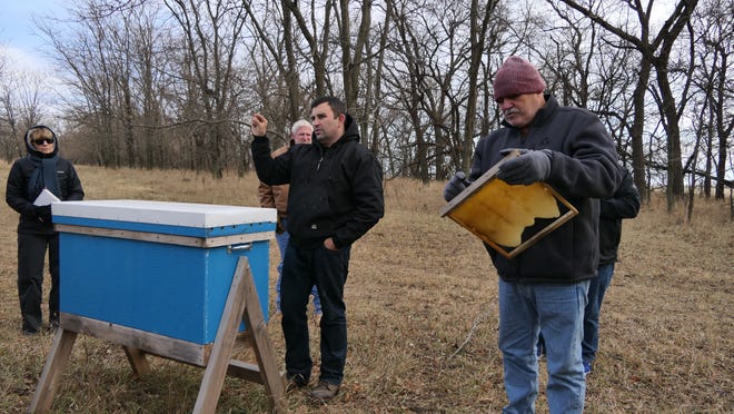 Jorge Garibay tells farmers about the benefits of bees during No-Till Field Day in December at Santa Fe Trail Farms in Windom. [Alice Mannette/HutchNews]