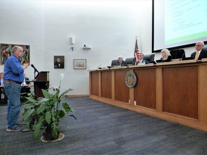 Former Bucks County Commissioner Andrew Warren addresses the Bucks County Board of Commissioners Wednesday. Seated are (from left) Brian Hessenthaler, chief operating officer; and Commissioners Robert Harvie, Diane Ellis-Marseglia and Gene DiGirolamo. [PEG QUANN / STAFF PHOTOJOURNALIST]