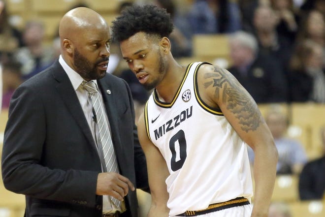 Missouri men's basketball coach Cuonzo Martin talks with sophomore guard Torrence Watson (0) in the second half of a game against Tennessee on Tuesday night at Mizzou Arena. [Chris Bowie/Tribune]