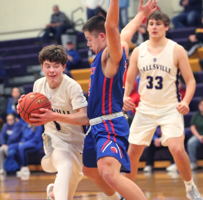 Jalen George, a Hallsville guard, attempts to drive past Moberly junior Dominic Stoneking during the Indians' home game Tuesday night. George led Hallsville's balanced scoring attack with 14 points to help the Indians knock off the Spartans 60-40. [Chuck Embree/Moberly Monitor-Index]