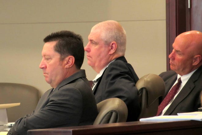 Convicted Palm Coast double murderer David Snelgrove, center, sits in court Wednesday during the opening day of testimony in his re-sentencing trial at the Kim C. Hammond Justice Center in Bunnell. Snelgrove is flanked by his Seminole County defense attorneys Michael Nielsen, left, and Jeff Stone. [News-Journal/Matt Bruce]