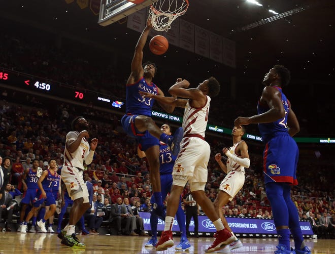 Kansas basketball forward David McCormack throws down a put-back dunk on the No. 3-ranked Jayhawks' 79-53 victory over Iowa State on Wednesday night at Hilton Coliseum in Ames, Iowa. [Reese Strickland/USA TODAY Sports]
