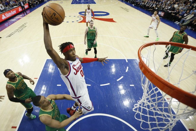 Philadelphia 76ers' Josh Richardson goes up to dunk past Boston Celtics' Grant Williams during Thursday’s game, in Philadelphia. [Matt Slocum / Associated Press]