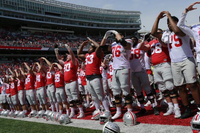 Ohio State football players sing the alma mater after the spring game on April 13 in Ohio Stadium. [File photo]