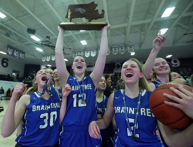 Braintree's Lily Adams, Ariana Fay, and Barbara Ronca celebrate their newly earned hardware after beating Springfield Central 71-50 in the Division 1 state final at Holy Cross on Saturday, March 16, 2019. [Wicked Local Staff Photo/ Robin Chan]