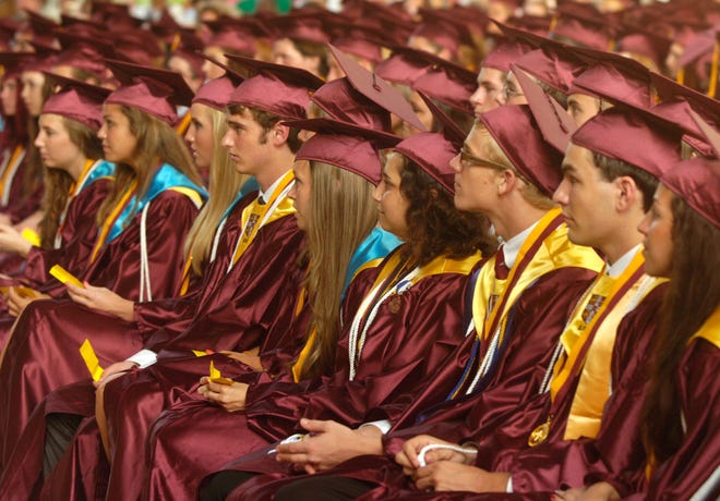 St. Augustine High School graduates listen to a speech at their commencement at the St. Augustine Amphitheatre in 2010. [PETER WILLOTT/THE RECORD]