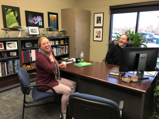 Washburn Rural High School German teacher Kaylee Barber, left, reacts earlier this week to the news she was named a Kansas Horizon Award recipient as principal Ed Raines celebrates with her. [Linda Ditch/Special to The Capital-Journal]