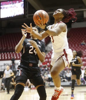 Alabama guard Jordan Lewis (3) goes to the basket against South Carolina guard Lele Grissett (24) in their game Sunday Jan. 5, 2020 in Coleman Coliseum. [Staff Photo/Gary Cosby Jr.]