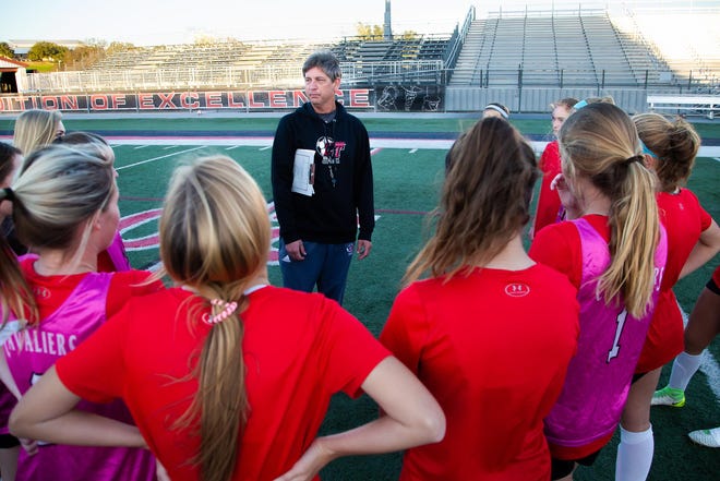 Lake Travis Cavaliers head soccer coach Trey Young explains the next drill at a girls soccer practice on Jan. 8 at Lake Travis High School. [JOHN GUTIERREZ/FOR STATESMAN]