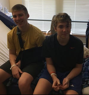 Brothers Colin and Evan Bostwick will soon begin outpatient therapy, less than one month after they were injured in a car crash on their way to Upper Cape Regional Technical School. [Photo courtesy of Pam Bostwick Coakley]