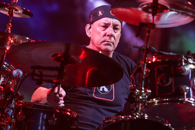 This Aug. 1, 2015, file photo shows Neil Peart of Rush performing during the final show of the R40 Tour in Los Angeles. Peart, the renowned drummer and lyricist from the band Rush, has died. His rep Elliot Mintz said in a statement Friday that he died at his home Tuesday in Santa Monica, Calif. He was 67. [Photo by Rich Fury/Invision/AP, File]