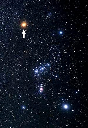 Betelgeuse is pointed out in this photograph of the constellation Orion. Rigel is the bright star in the lower right. The Orion Nebula, M42, is located below the three stars of Orion’s Belt. Visible to unaided eyes, it is a fine binocular target. [Wikimedia Commons/Public Domain]