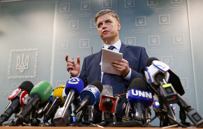 Ukrainian Minister for Foreign Affairs Vadym Prystayko gestures while speaking to the media during a news conference in Kyiv, Ukraine, Friday, Jan. 10, 2020. Prystaiko said that Ukraine will demand compensation from Iran if it's confirmed that the Ukrainian airliner that crashed near Tehran this week was downed by an Iranian missile. (AP Photo/Efrem Lukatsky)