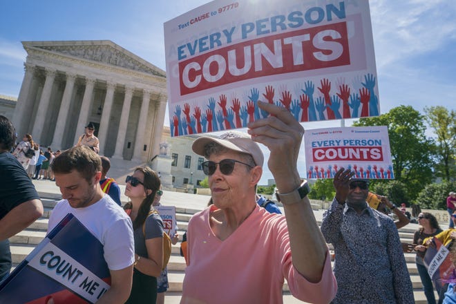 Immigration activists rally outside the Supreme Court as the justices hear arguments in 2019 over the Trump administration's plan to ask about citizenship on the 2020 census. [J. Scott Applewhite/Associated Press]
