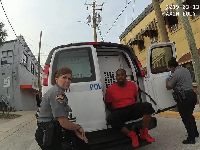 This is a still frame of Jonah Scott Miller being wrongly arrested on March 13, 2019 when police mistook him for a man who had stolen his identify. Daytona Beach Police Officer Dawn Harris is on his left. [Daytona Beach police body camera frame grab]