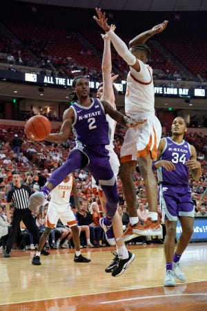 Kansas State guard Cartier Diarra (2) looks to pass as Texas' Jase Febres (13) and center Will Baker (50) defend during the second half Saturday night in Austin, Texas. [SCOTT WACHTER/USA TODAY SPORTS]