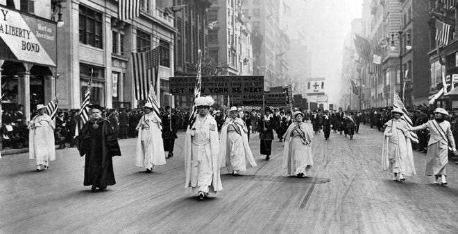 Dr. Anna Shaw and Carrie Chapman Catt, founder of the League of Women Voters, lead an estimated 20,000 supporters in a women's suffrage march on New York's Fifth Avenue in 1915. [Associated Press]