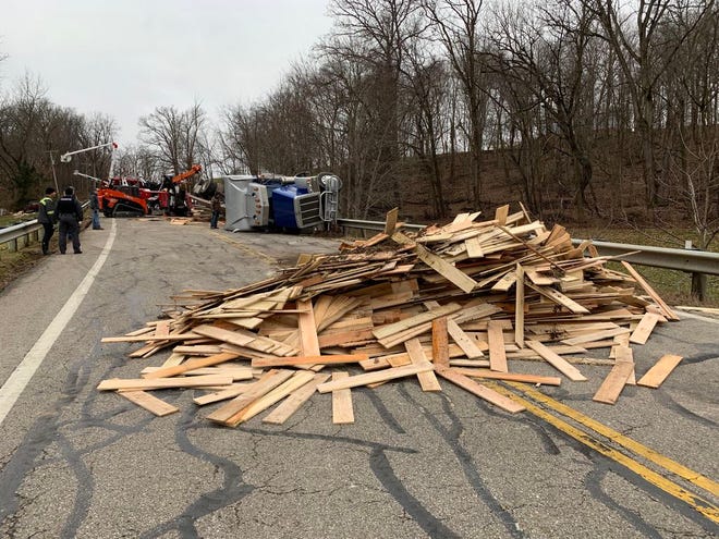 These wood planks were cleaned up after falling off the tractor-trailer which flipped on State Route 3.