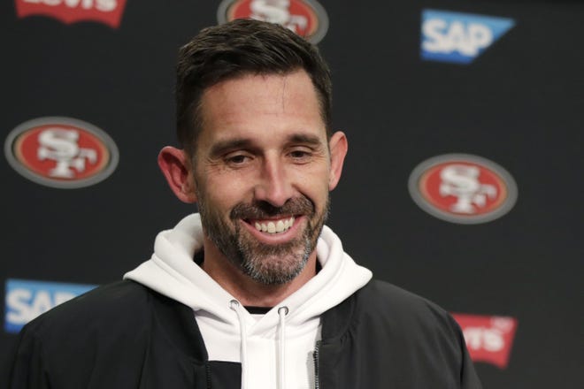San Francisco 49ers head coach Kyle Shanahan smiles during a news conference after Sunday's 26-21 win over the Seattle Seahawks. [STEPHEN BRASHEAR/AP]