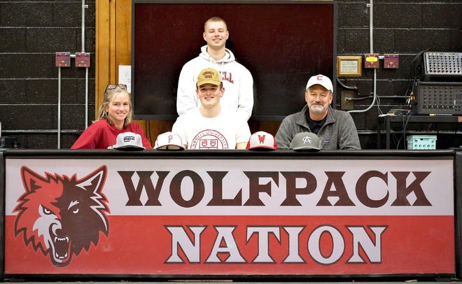 Oppenheim-Ephratah-St. Johnsville senior Von Baker announced his college decision and signed his national letter of intent to attend Cornell University and continue playing baseball Wednesday at halftime of the Wolves’ game against Notre Dame-Bishop Gibbons of Schenectady. Baker, a 6-foot-7 pitcher, is the first athlete from the school to sign with a Division I college program since the district merger and he is the class of 2020 valedictorian. [Photo Courtesy of Travis Heiser, Oppenheim-Ephratah-St. Johnsville]