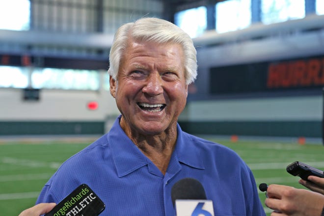 FILE - In this Wednesday, Aug. 21, 2019, file photo, former Miami football coach Jimmy Johnson talks to the media after an NCAA college football practice in Coral Gables, Fla. Johnson, who coached the Dallas Cowboys to two Super Bowl championships in the 1990s, has been elected to the Pro Football Hall of Fame. (David Santiago/Miami Herald via AP, File)